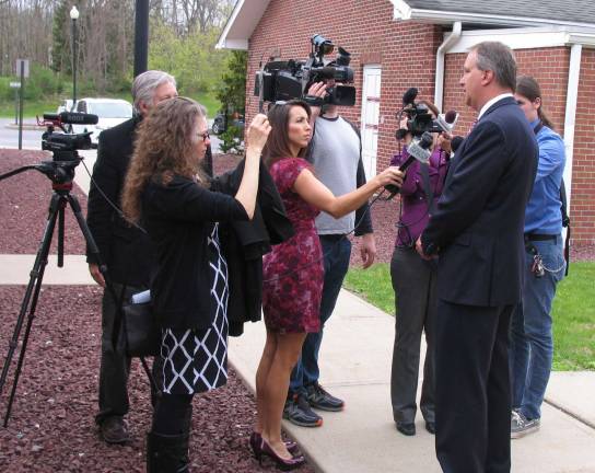Photos by Roger Gavan Orange County District Attorney David M. Hoovler speaks with reporters outside Warwick Town Court Thursday, April 28, following the arrest of 18 people in connection with a cocaine distribution network in Orange, Sullivan and Sussex counties.