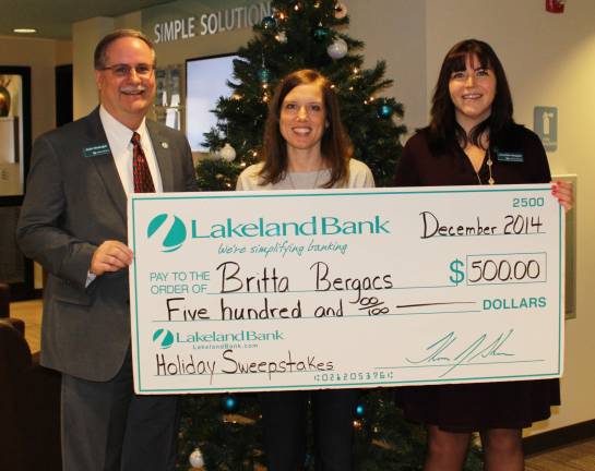 Britta Bergacs, center, was the winner of Lakeland Bank's Holiday Debit Card Sweepstakes. Keith Niedergall, senior vice president and Jennifer Hopper, vice president, branch manager of Vernon, presented Bergacs with a $500 check.