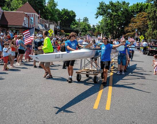 Sparta. Fourth of July events Members of the Sussex County Rowing Club with one of their boats.