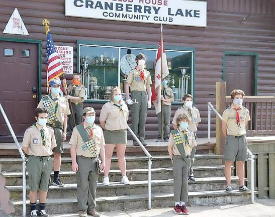 Scouts from Troops 151, 1151 and 276 stand in respect to our fallen service members and first responders. (Photo provided)