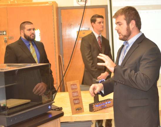High Point school showcases technology Instructor Matt Garrera speaks to the Carvey Machine's capabilities.