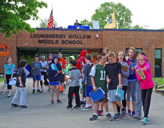 As Lounsberry Hollow Middle School students head to the sports fields nextdoor, School Principal Charles McKay can been seen on the rooftop in his temporary office for the day.