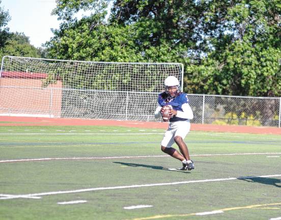 New era for SCCC football <b>Sussex quarterback Maurice Williams holds the ball.</b>