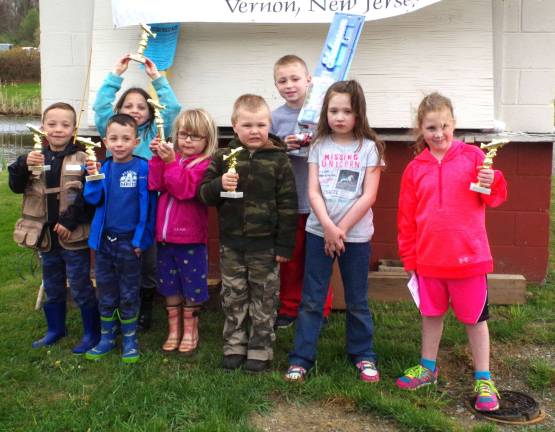 Winners in the Grades K-2 division show off their trophies and prizes.