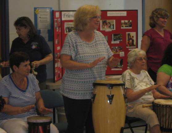 Library hosts drum circle The group follows the rhythm tones of the leader.