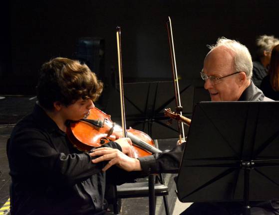 Michael Romanelli is shown on viola.