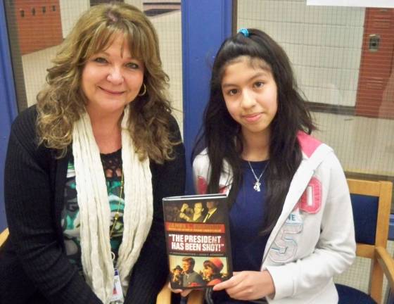 Glen Meadow student wins contest Ashlynne Baumgart, right, is shown with Glen Meadow language arts teacher, Mrs. Basso.