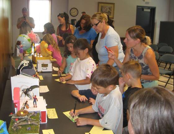 Shoeboxes float at the library Children vote for their favorites.