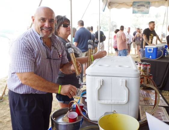 Charlie Benedetti, owner of the Newburgh Brewing Company enjoyed serving up free samples of his three delicious beers during the 8th Annual Crystal Springs Beer &amp; Food Festival.