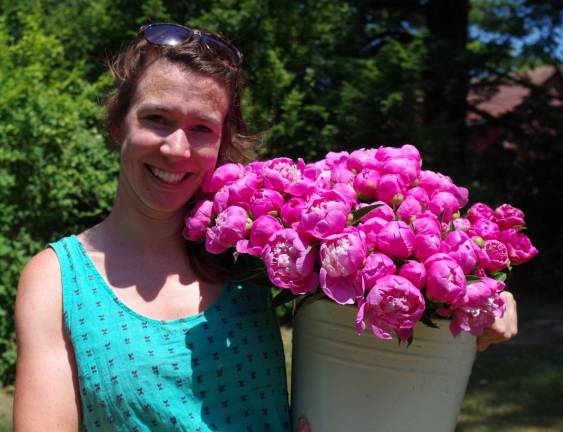 Event coordinator and garden manager Quill Teal-Sullivan had just returned from the greenhouse with a bouquet of freshly cut peonies.
