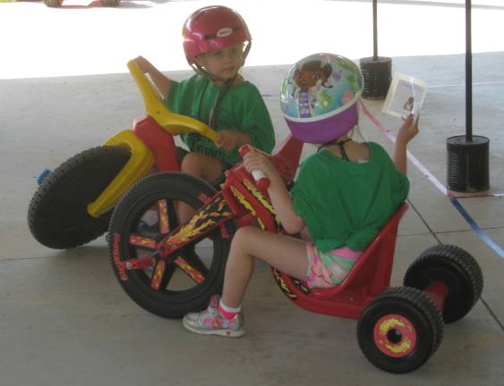 Upcoming kindergartners visit Safety Town PHOTOS BY JANET REDYKE Oops! A crash occurs on the traffic course.