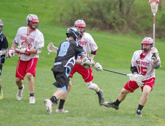 High Point falls to Parsippany Hills High Point's Evan Poust maneuvers on the field and uses his crosse to hold up the ball.