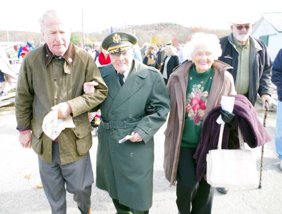 From left United States Representative Rodney Frelinghuysen, retired Army Lt. Col. and Chaplain Ernie Kosa and his wife Barbara walk together.