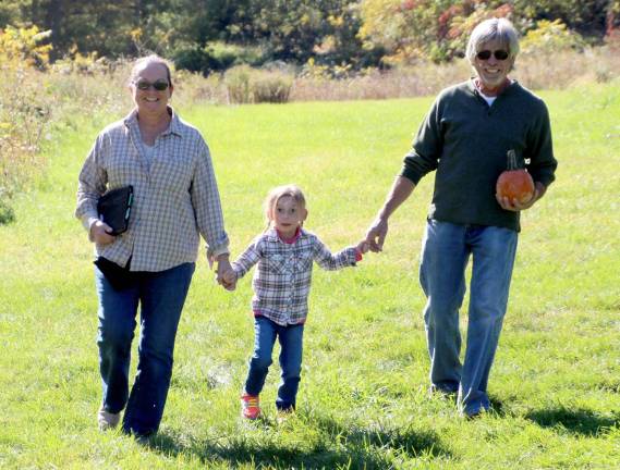Lusscroft Farm holds pumpkin painting Evalyn Carella with James and Elise Castner of Wantage picking pumpkins to paint.