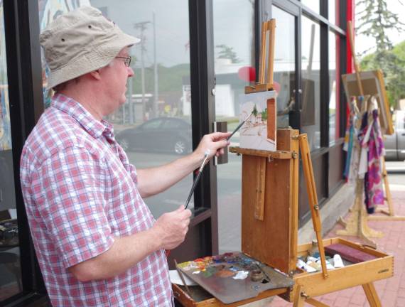 Sparta-based painter Tim Maher worked &#xfe;&#xc4;&#xfa;en plein air&#xfe;&#xc4;&#xf9; capturing the uniqueness of downtown Hamburg with oil paints.
