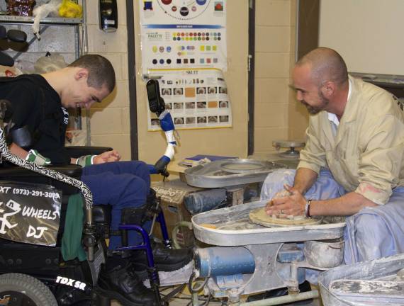 Student with cerebral palsy makes pottery