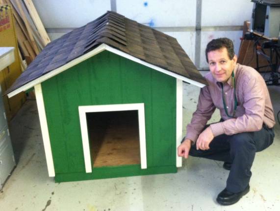 Steve Wagner is shown with the doghouse.