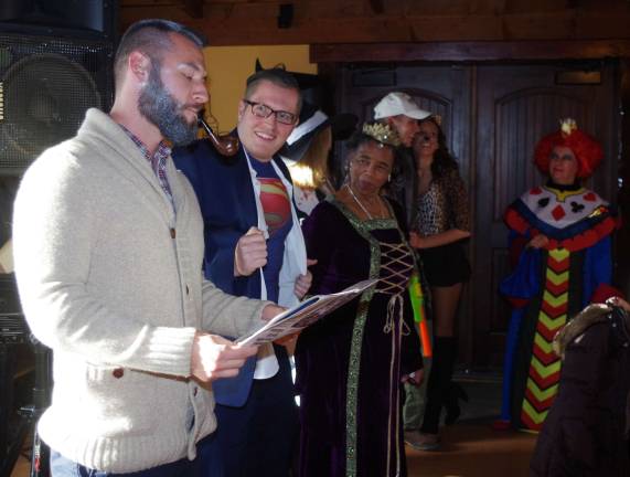 Winery offers an adults only Halloween party Costumed contestants line up in front of the band.