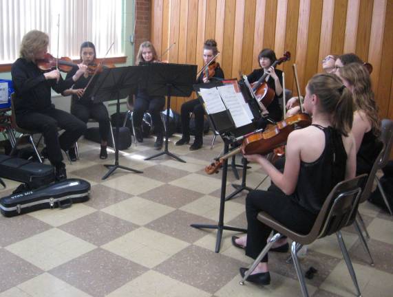 High tea participants were entertained by members of the Vernon Township High School Chamber Orchestra.