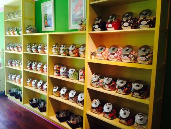 Newton candy store is a cornucopia of colors and confections An assortment of flavors line the walls.