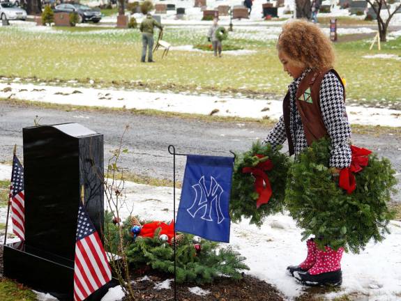 PHOTOS BY VERA OLINSKI Girl Scout Olivia honors and remembers veterans.