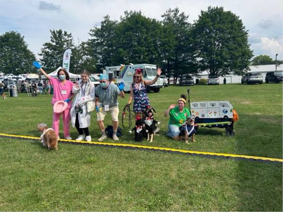 Dogs have their day Winners in the costume contest, from left, are in second place Gianna, Preston and Joanne Macon and their dog Maple as grandma and nurses; in third place Beau and Bowie as wedding dates; and in first place Packers the grateful dog and owner Elena Philolius.