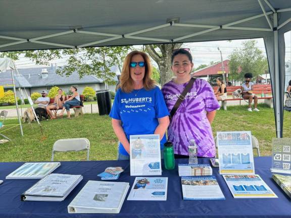 Dogs have their day Carol Fass and Eilis Calnan of St. Hubert’s Animal Welfare Center in Chatham Township.