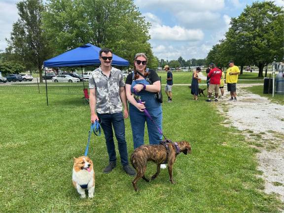 Dogs have their day Brian and Shay Powers with their dogs Finn & Sadie. They adopted Sadie at the festival last year through Father John’s Animal House.
