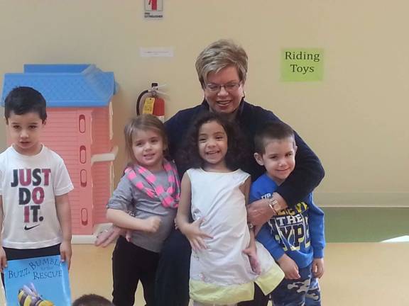 Sprouts welcome celebrity reader to class Sparta realtor Julie Killen with the students at the Little Sprouts Early Learning Center.