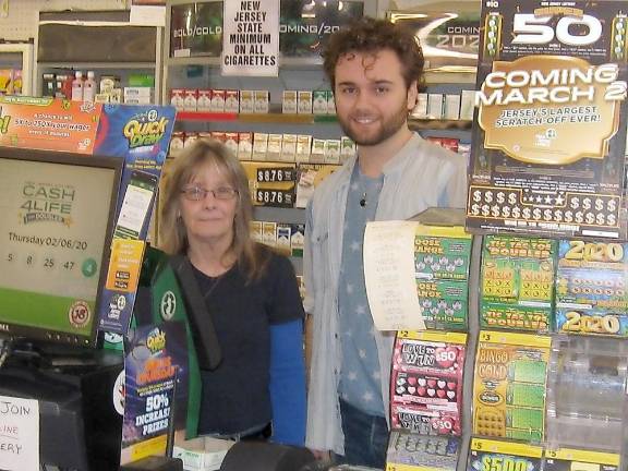 Linda Storms and Carl Contino are ready at the NJ Lottery’s Green Machine at the Highland Lakes General Store.