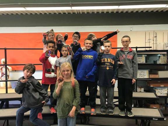 Fourth-grade science students in Lounsberry Hollow School, in Vernon, learned about past organisms by discovering different ways fossils can be formed. Students learned the difference between a mold or caste fossil by constructing a fossil of their own.
