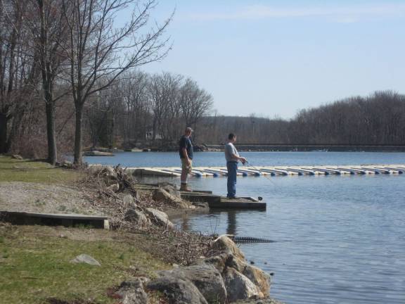 PHOTO BY JANET REDYKE Two fishermen enjoy the great weather at the &quot;Big&quot; lake in Highland Lakes.