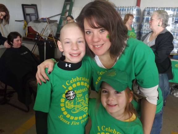 Sherri Kardos of Wantage, N.J. &quot;Going green for charity. My son Brian, myself and my daughter Baylee after Brian shaved his head at the Sussex Fire Department St. Baldricks event March 15. This was his third time raising money for kids with cancer.&quot;