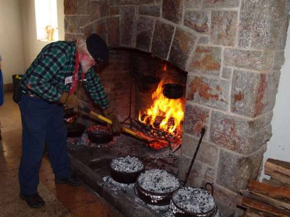 Friends of High Point host hearth cooking day Fire Master Robert Barth of Somerville, N.J. tends to the hearth fire. The metal pots contain food. The Friends of High Point State Park hosted their annual Open Hearth Cooking Day on Saturday, October 26, 2013. The event took place inside the Interpretive Center. Cooking demonstrations featuring a variety of foods were available to visitors to sample.