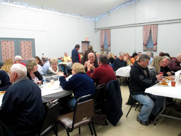Residents enjoy dinner at the Colesville Fire house on March 28 for the Wantage Township First Aid Squad.