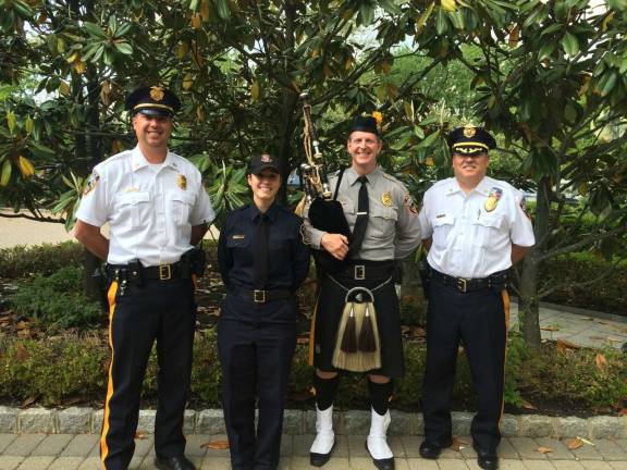 Ptl. Miranda Meore, second from left, is shown with Vernon Township police Lt. Daniel Young, left, and Capt. Stephen Moran, a member of the Morris County Police Pipes &amp; Drums, and Chief Randy Mills at right.
