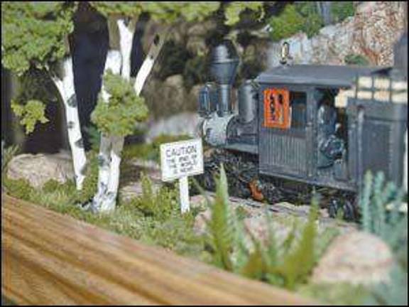 Model trains and colorful candy draw crowds Model trains and colorful candy draw crowds