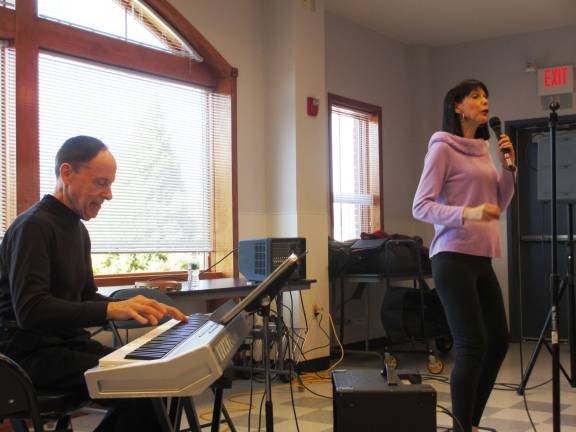 Photo by Viktoria-Leigh Wagner Singer Francine Evans sings and performs while her husband, Joel Zelnik, plays the keyboard.