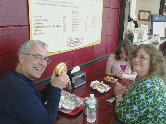 Douglas Beck, wife Irene and daughter Amanda tuck into some tasty dogs at Jersey Dog.