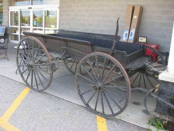 PHOTO BY JANET REDYKENo, pioneers are not shopping at the Vernon Acme. This wagon decorates the front of the store remembering the past.