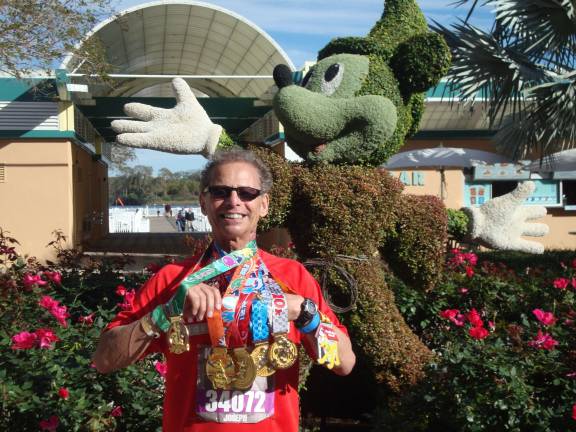 Locals go a little Dopey for Disney World races Joseph Farinella, 75, of Andover shows off his six medals for completing Disney World's Dopey Challenge.
