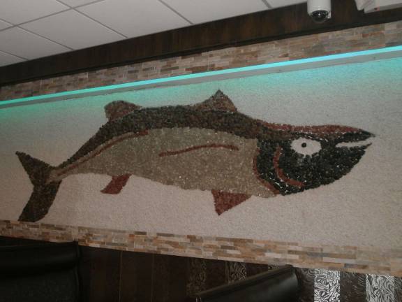 Wings Asian Fusion Bistro opens in Vernon A 27 foot fish waterfall, designed with rocks gathered by the owner, decorates an interior wall.