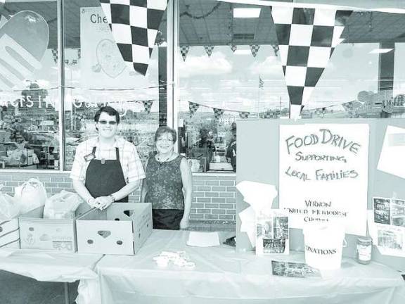Supermarket, church team up for charity ShopRite Associate Chris Maslin and Vernon United Methodist Church Director Sharon Fitch work together to collect canned goods from shoppers for the food pantry.