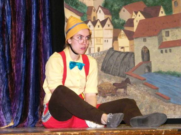 Photo by viktoria-Leigh Wagner Pinocchio, played by Samantha Evans, has just been cheated out of his gold coins by the wicked Mr. Fox, played by Maxwell Bennett.