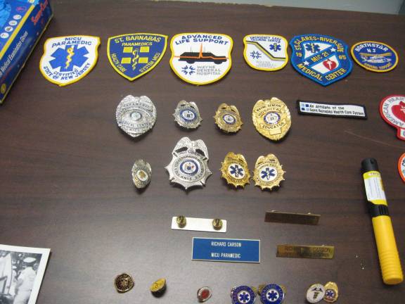 Historical society event celebrates ambulance squad PHOTOS BY JANET REDYKEThe many badges of Vernon Ambulance Squad member Rich Carson honor years of service.