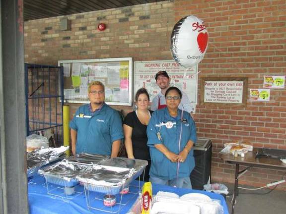 ShopRites help fight hunger From left, Nick Alamo, Patti Holster, Joe Italiano, and Beverly Ruddock man the grill outside of the Franklin ShopRite where they make snacks.