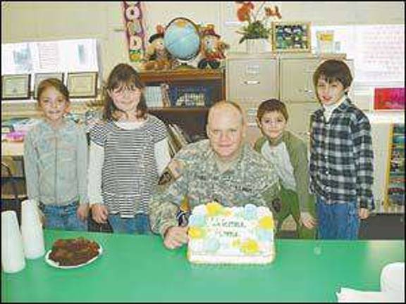 Students welcome soldier to classroom Students welcome soldier to classroom