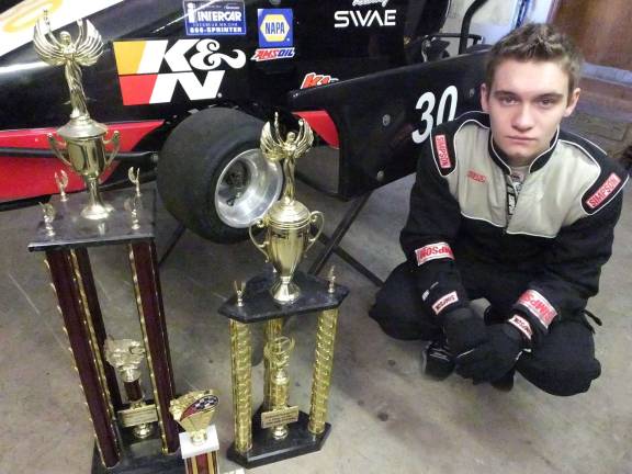 Smith with trophies he has won.