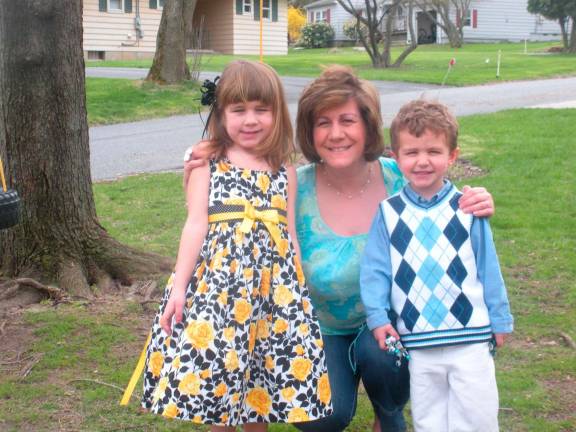 Kelly Eisenhardt of Sparta with her children on Easter Sunday a few years ago.