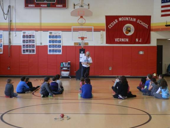 Cedar Mountain hosts heart event CMPS Physical Education TeacherLeslie Deutch gives pre-Jump Rope for Heart instructions to one of her third-grade classes.